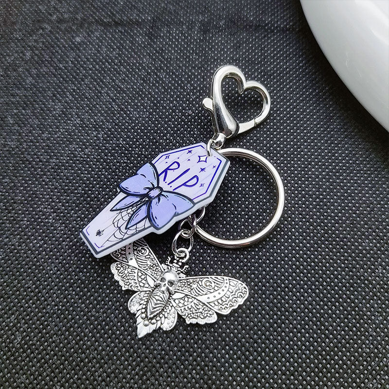Keyquins de ataúd de mariposa de calavera de estilo retro de estilo retro al por mayor